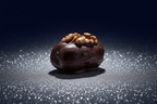Single very dark chocolate walnut date